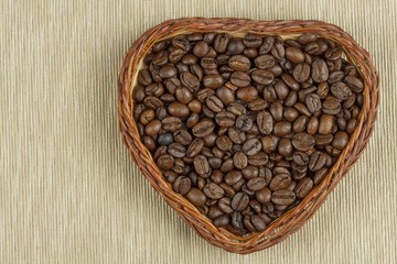 Roasted coffee beans on the kitchen table. Fresh coffee. Preparation of hot coffee. Refreshing drink. Sales of coffee beans. Advertising for coffee shop. We love fresh coffee.
