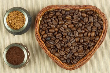 Roasted coffee beans on the kitchen table. Fresh coffee. Preparation of hot coffee. Refreshing drink. Sales of coffee beans. Advertising for coffee shop. We love fresh coffee.
