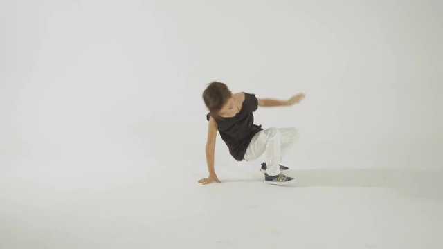 Little Stylish Boy Break Dancing And Having Fun, Isolated On WhiteStudio Shot