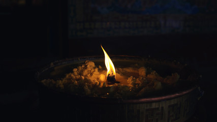 Candle in a tibetan buddhist monastery