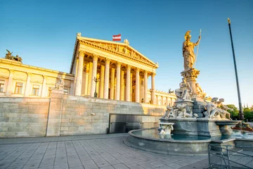  Austrian parliament building with Athena statue on the front in Vienna on the sunrise © rh2010