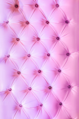 Pink buttoned leather background