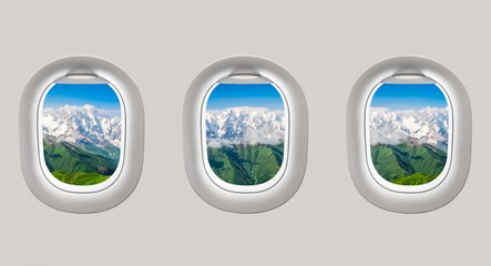 Looking out the windows of a plane to the mountains in Georgia
