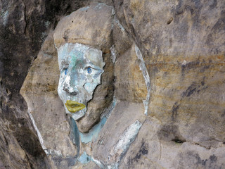 Fototapeta na wymiar Rock relief - the face of the Sphinx