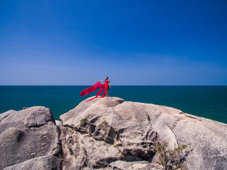 Woman in red flying dress