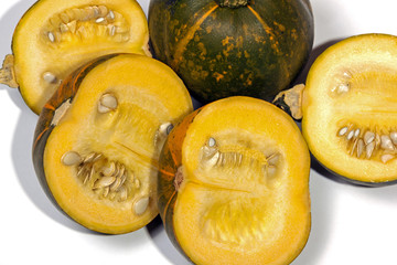 Close Up Shot of Four Yellow Halved Gem Squash on White