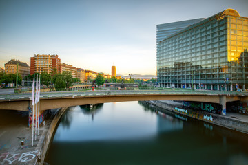 Modern district with contemporary buildings near the water channel in Vienna in the morning
