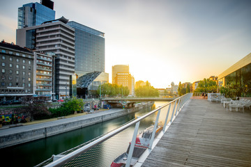 Modern district with contemporary buildings near the water channel in Vienna in the morning