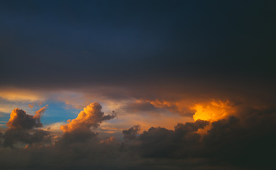 red-orange sunset on the tightened sky rain clouds.