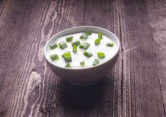 Sour creame. Round dish of homemade tartar sauce. Sour cream wit