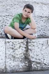 Sad Little Boy Sitting On Steps