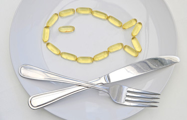 Fish Shape Cod Liver Oil Tablets on Plate