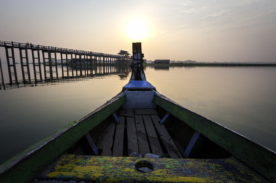 Wooden boat in Ubein Bridge at sunrise, Mandalay, Myanmar (World