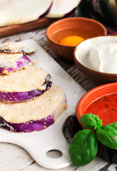 eggplant slices with breadcrumbs and other ingredients for parmi