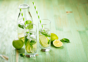 Lemonade drink on a wooden background