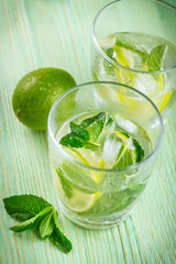Lemonade drink on a wooden background