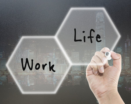 work life balance in cityscape background with hand writing
