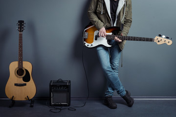 Obraz premium Hot man with his guitars