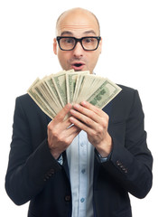 Surprised bald man holding a lot of money