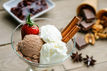 Ice cream sundae, chocolate, walnuts and jam