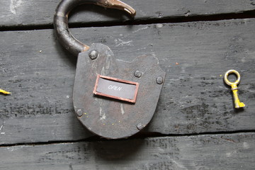 Open sign and old padlock 