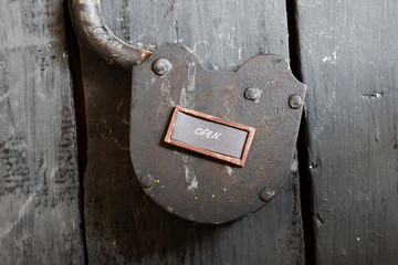 Open sign and old padlock 