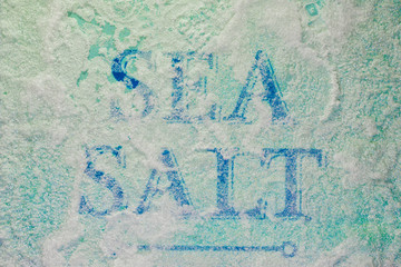 The inscription Sea Salt covered with close up salt crystals