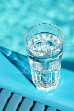 Glass of water on a blue background
