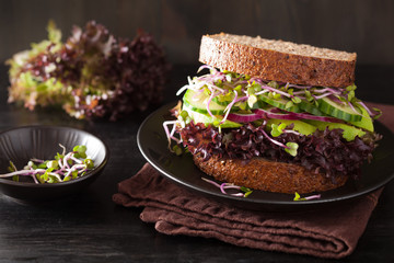 avocado cucumber sandwich with onion and radish sprouts - Powered by Adobe
