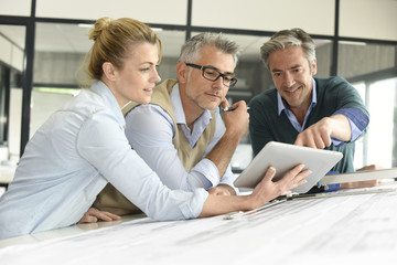 Team of engineers working together on project