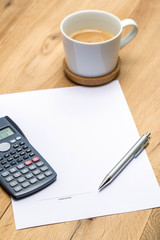 Paper with signature and grey pen on desk