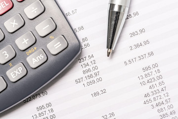 Documents with calculator and pen