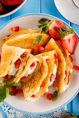 Crepes with strawberries and cream 