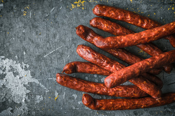 Chorizo Sausages on old metal background right