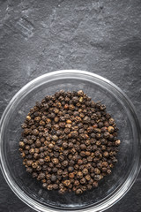 Black pepper on the glass plate