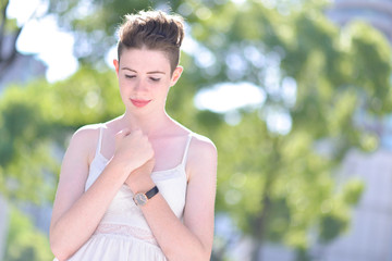 A portrait of a beautiful young Caucasian woman outdoor