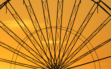 Abstract Background,  ferris metal-wheel against sky with sunset.