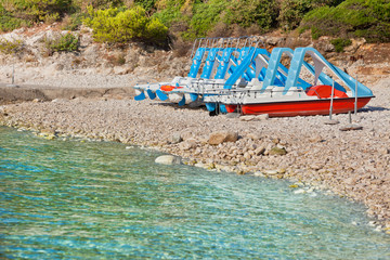 Multicolored catamarans on the beach