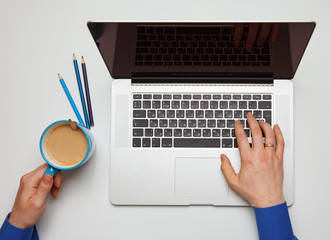 Male hand with laptop Break Concept. top view