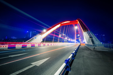 Fototapeta na wymiar traffic trails at caiyuanba yangtze river bridge,chongqing china.