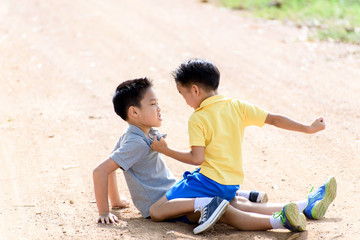 Fototapeta premium Boys are brother punch and fighting