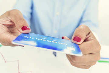 young woman with a credit card in her hands