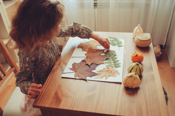 preparations for autumn craft with kids. Herbarium from dried leaves. Learning children at home,...