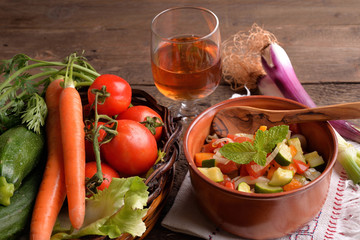 terracotta bowl with pasta and vegetables