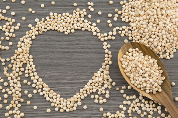 Millo cereal seeds on wooden table