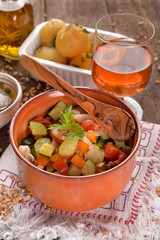 terracotta bowl with pasta and vegetables