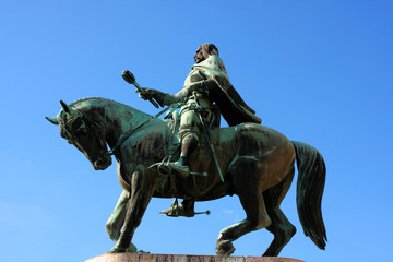 Fototapeta na wymiar A statue of Janos Hunyadi on Szechenyi Square in Pecs, Hungary