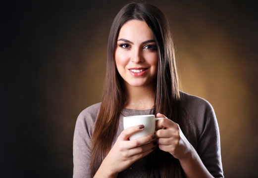 Portrait of pretty woman with cup of coffee