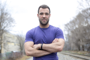 Fototapeta premium nice young man portrait on the railroad