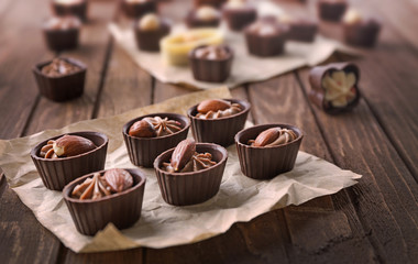 Chocolate sweets on wooden background